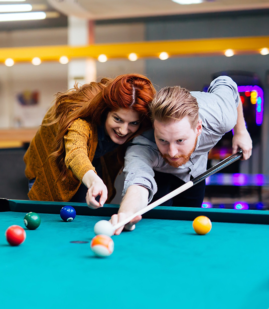 Couple playing pool