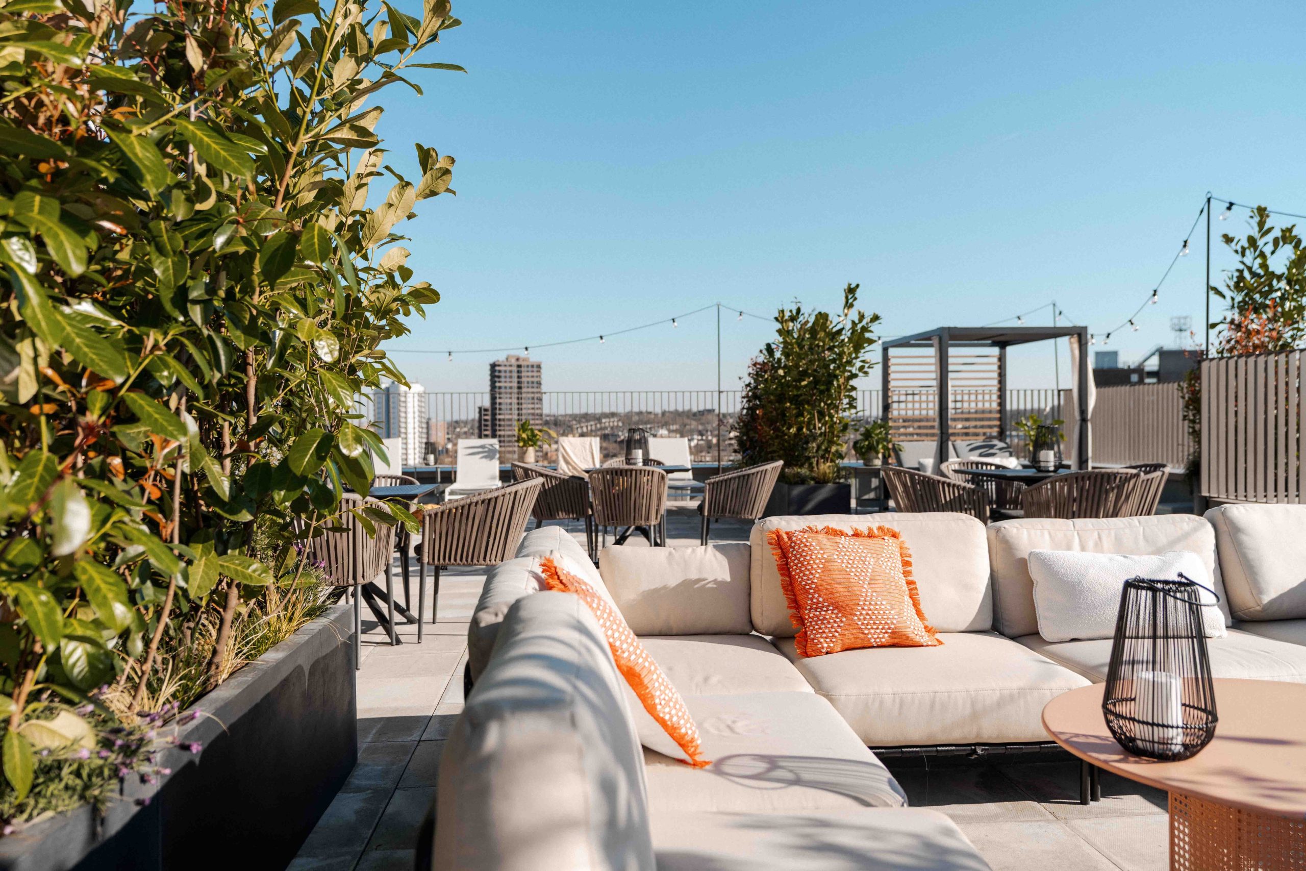 Seating on the student accommodation rooftop with sunny sky