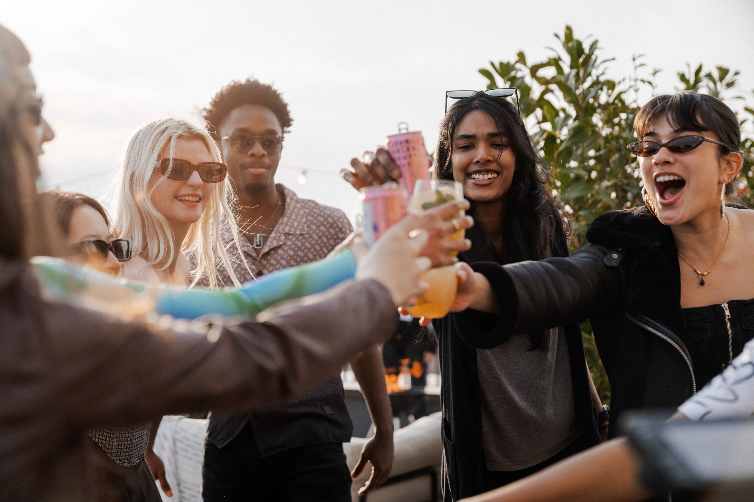 International students cheers drinks in the summer