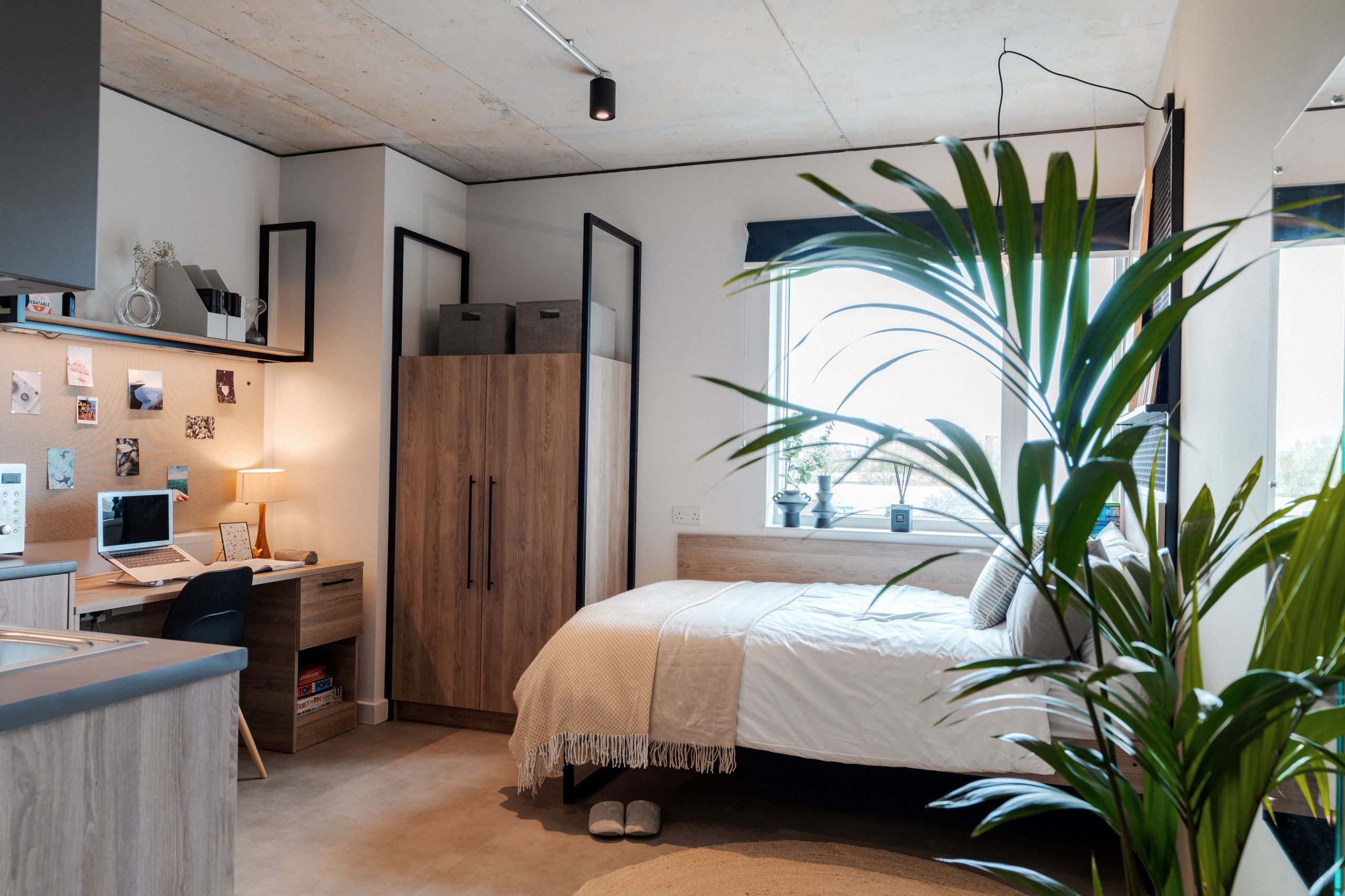 Luxury student accommodation with a bed, wardrobe and desk area
