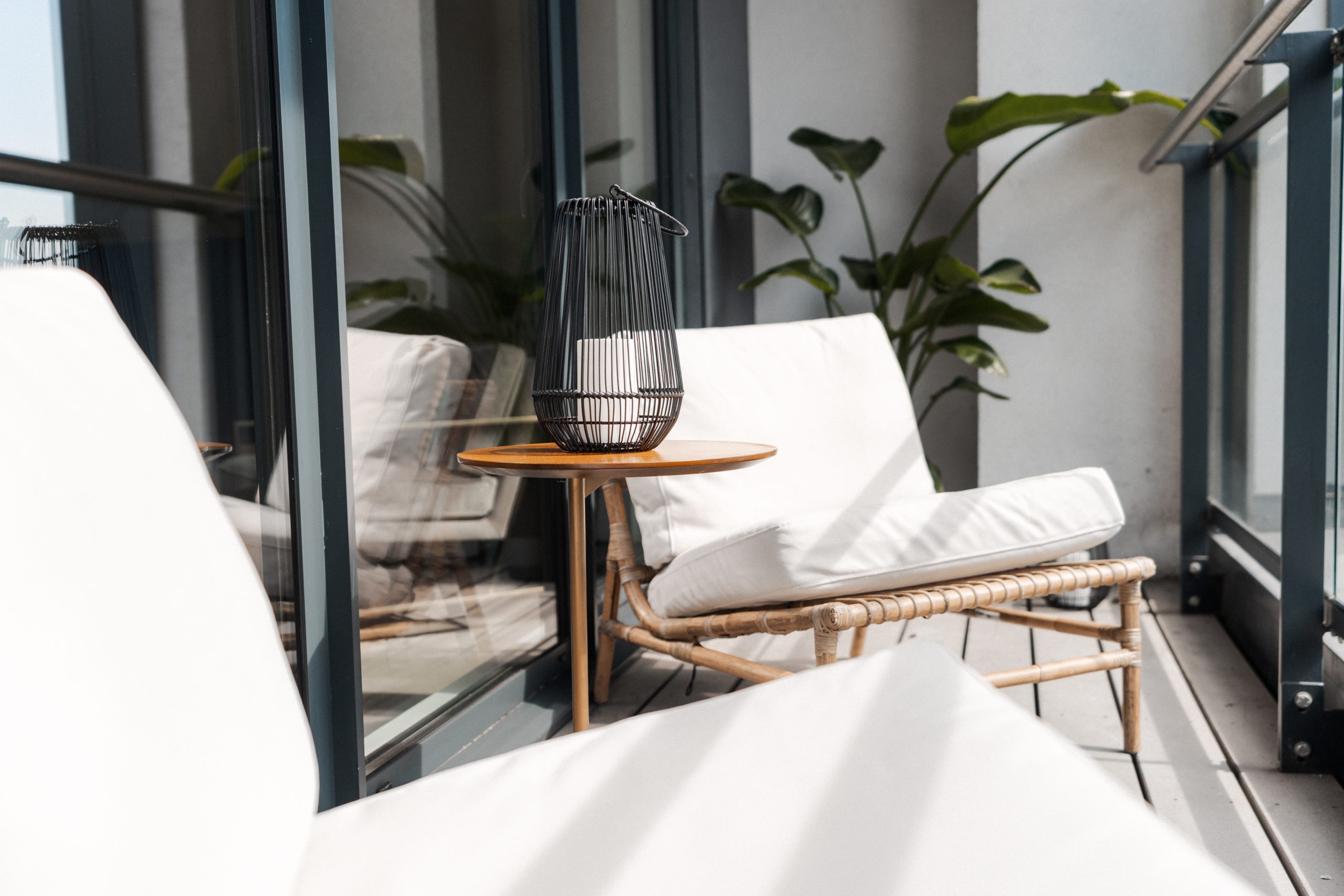 White fabric chairs on the balcony of YourTRIBE's student accommodation.