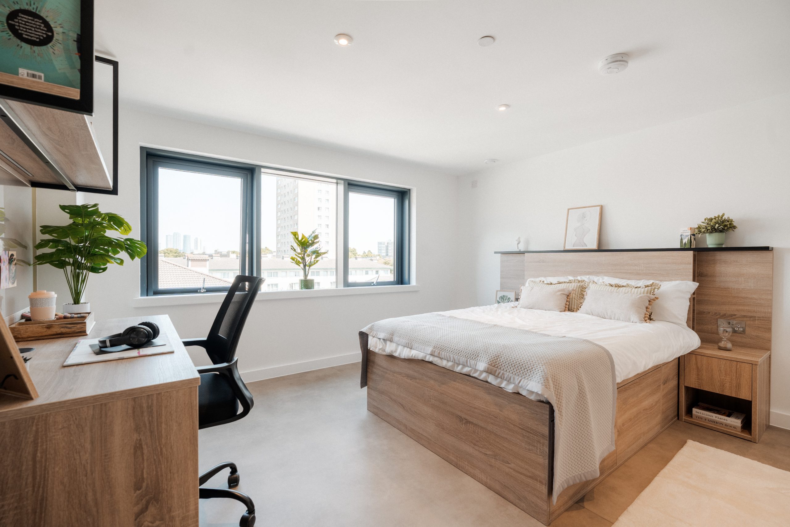 London student accommodation room with neural decor, bed and desk