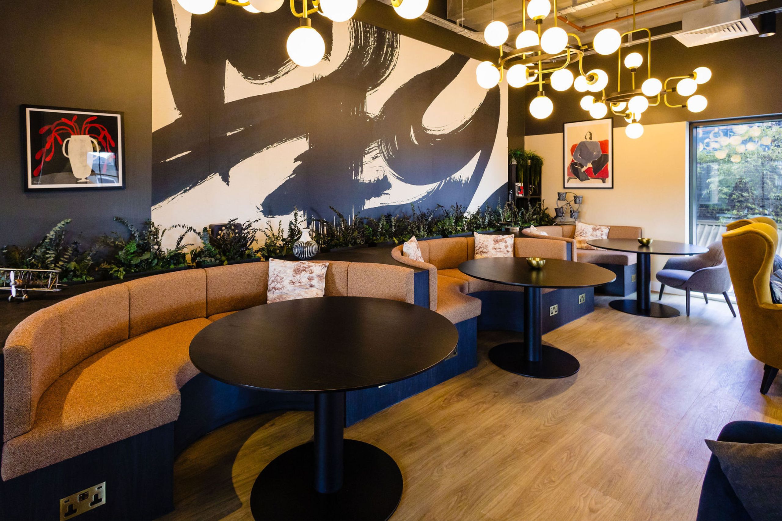 Student accommodation space with sofas and round lights