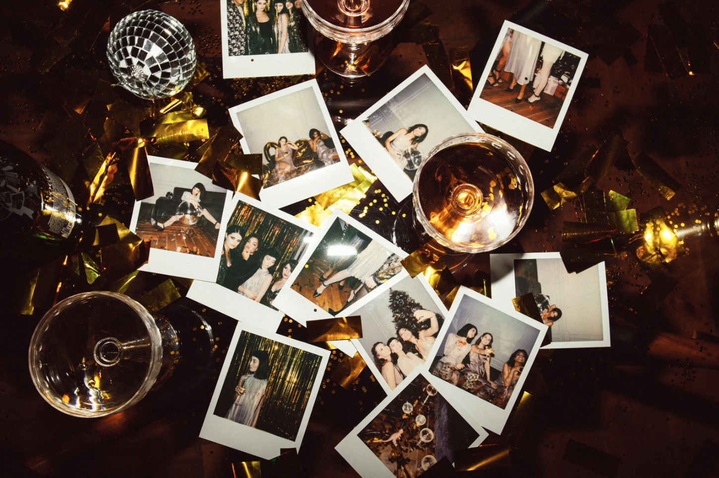Polaroid pictures of students partying surrounded by prosecco glasses and tinsel.
