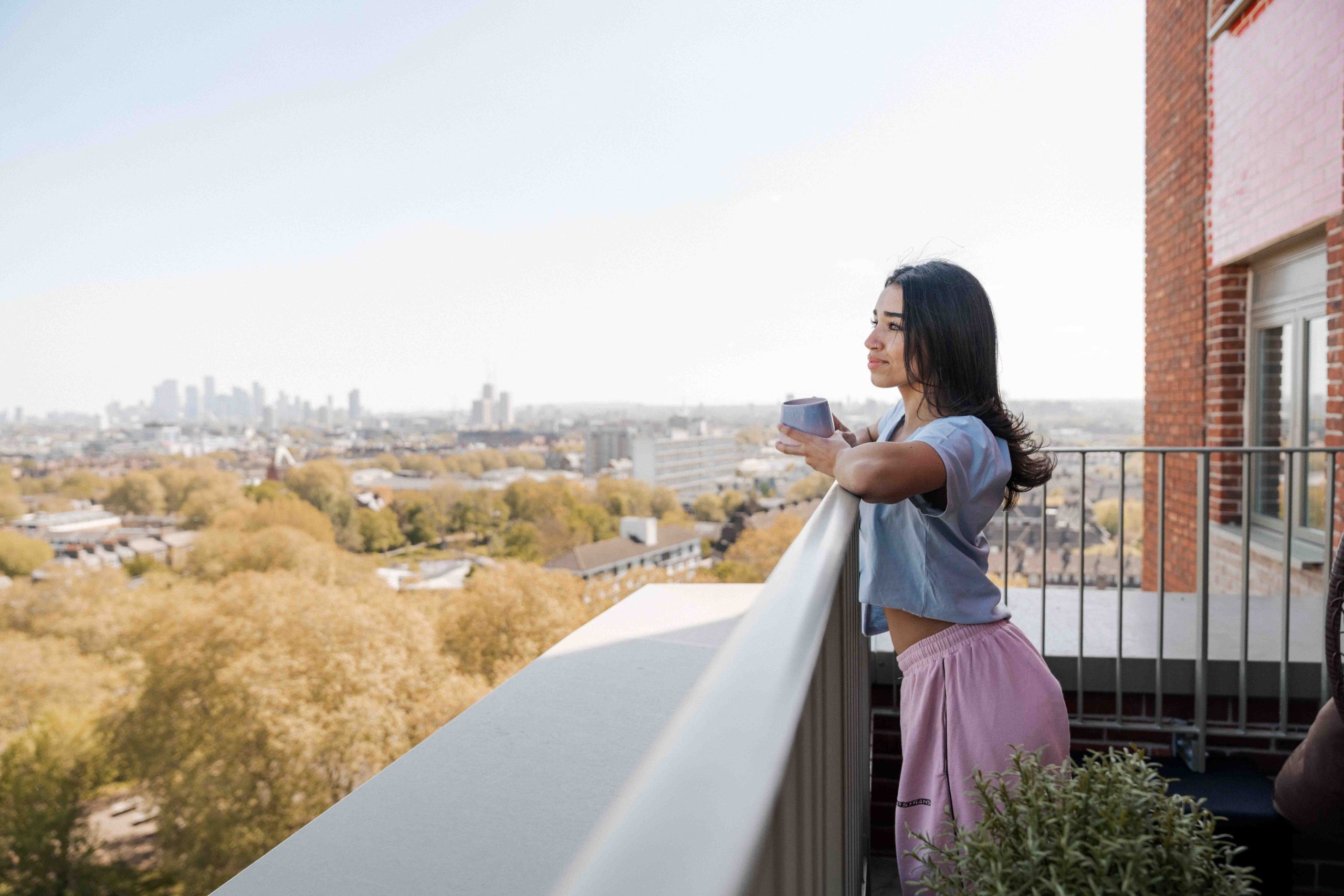 Student stands on the roof terrace overlooking Elephant and Castle