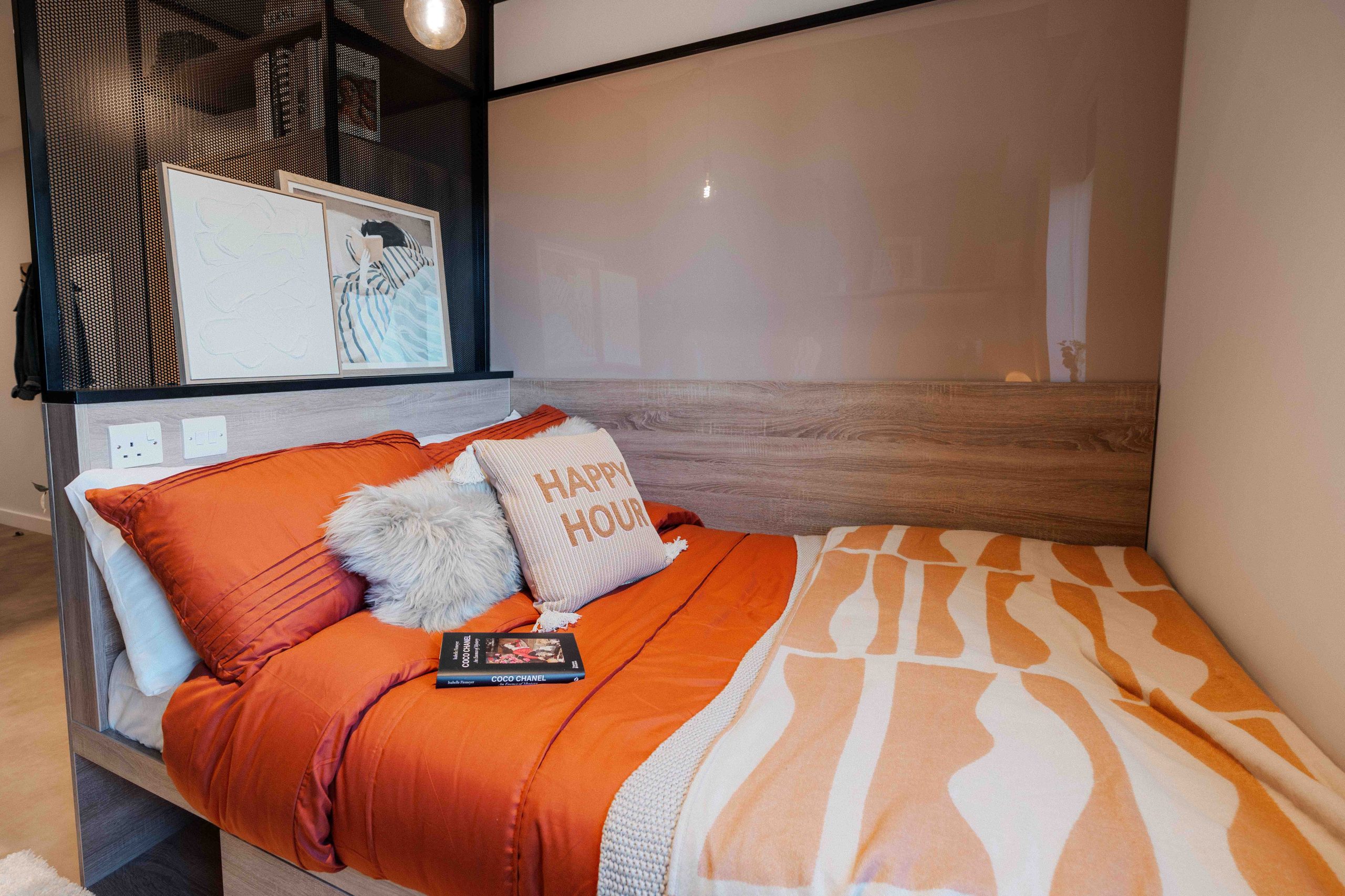 Student bed with an orange duvet
