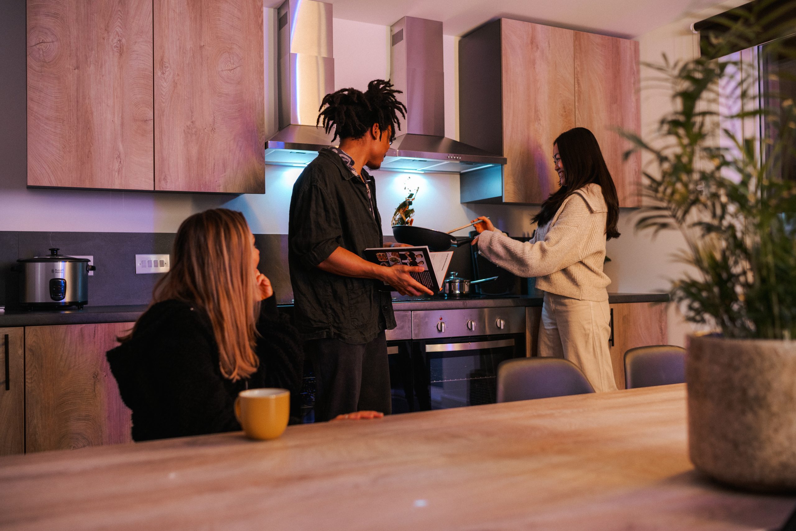 YourTRIBE students in a kitchen area inside their accommodation