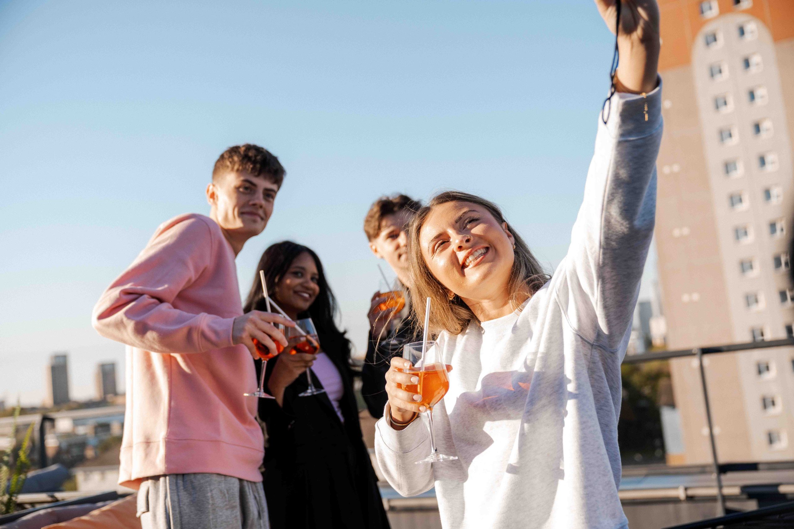 Students taking a selfie on a rooftop